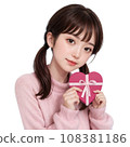 Girl holding a heart-shaped Valentine chocolate box with an AI-generated ribbon Girl holding a heart-shaped Valentine chocolate box with an AI-generated ribbon 108381186