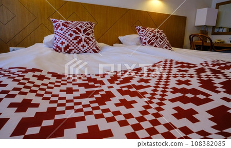 Recreation area in the hotel. Bed linen with red national symbols of Estonia Recreation area in the hotel. Bed linen with red national symbols of Estonia 108382085