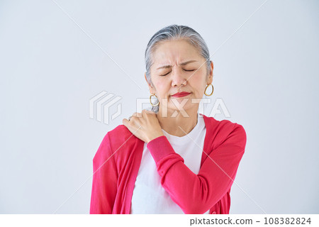 Senior woman suffering from stiff shoulders Senior woman suffering from stiff shoulders 108382824