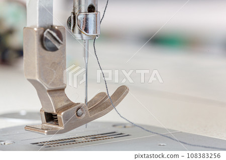 Sewing machine needle with thread and fabric Sewing machine needle with thread and fabric 108383256