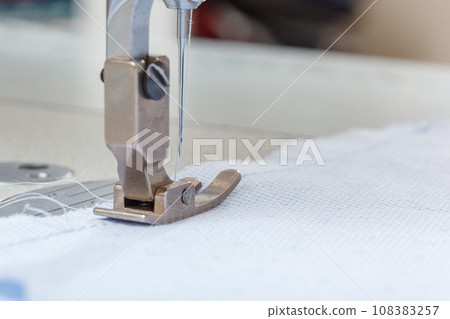 Sewing machine needle with thread and fabric 108383257