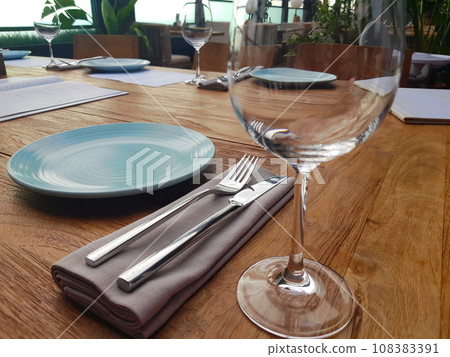 Table setting with cutlery and napkin in restaurant closeup 108383391