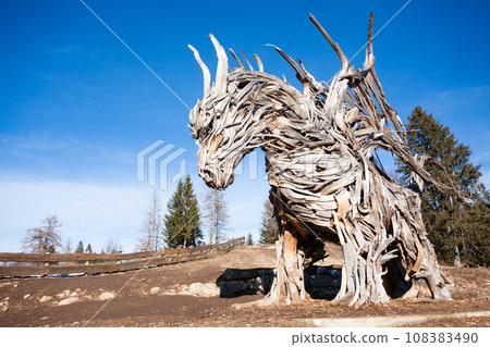 Wooden sculpture of a dragon. Italian landmark 108383490
