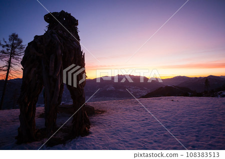 Wooden sculpture of a wolf. Italian landmark at dawn Wooden sculpture of a wolf. Italian landmark at dawn 108383513