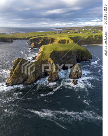 Aerial view of the beautiful coast at Malin Beg in County Donegal, Ireland. Aerial view of the beautiful coast at Malin Beg in County Donegal, Ireland. 108383829