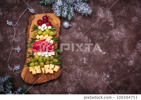 Appetizers plate in shape of Christmas tree. Appetizers plate in shape of Christmas tree. 108384751