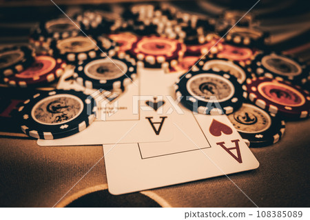 Dealer or croupier shuffles poker cards in a casino on the background of a table, chips. Concept of poker game, game business. Playing for money, a big win, a jackpot, gambling, a desire to get rich. Dealer or croupier shuffles poker cards in a casino on the background of a table, chips. Concept of poker game, game business. Playing for money, a big win, a jackpot, gambling, a desire to get rich. 108385089