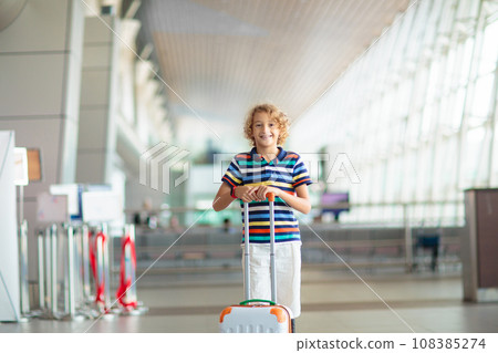 Family in airport. Kids fly. Travel with child. Family in airport. Kids fly. Travel with child. 108385274