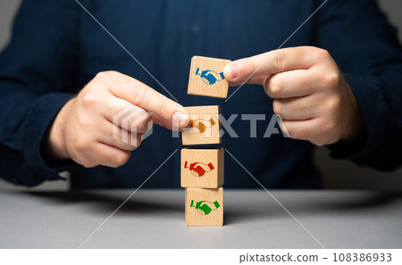 The mediator helps close the deal. Set dialogue of opponents. Sign the contract. Come to a consensus. Cooperation instead of competition. Mediation between sides. Reaching an agreement. 108386933