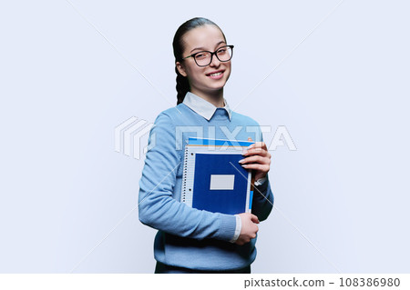 Portrait of teenager girl high school student on white background Portrait of teenager girl high school student on white background 108386980