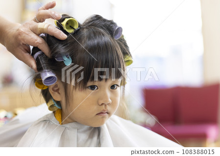 Girl with hair curlers (3 years old, Japanese) Girl with hair curlers (3 years old, Japanese) 108388015