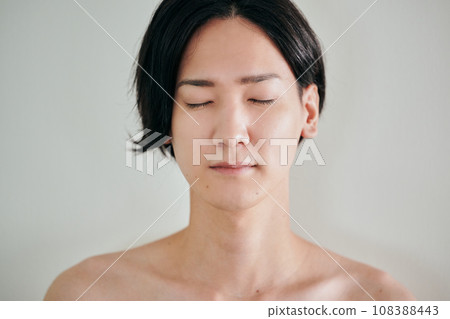 Shirtless young man with eyes closed Shirtless young man with eyes closed 108388443
