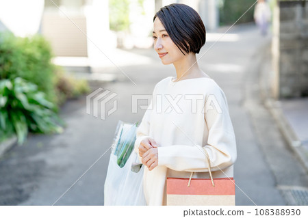 A woman with a shopping bag A woman with a shopping bag 108388930