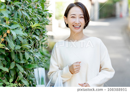 A woman with a shopping bag A woman with a shopping bag 108388931