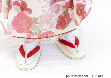 Feet of a girl wearing a Shichi-Go-San kimono (3 years old, Japanese) Feet of a girl wearing a Shichi-Go-San kimono (3 years old, Japanese) 108389192