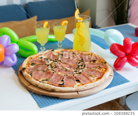 Pizza with ham and mushrooms homemade tasty italian. Pizza with ham and mushrooms homemade tasty italian. 108389235