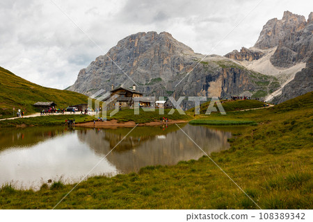 Segantini Hut in mountain valley on lakeside at foot of Italian Dolomites Segantini Hut in mountain valley on lakeside at foot of Italian Dolomites 108389342