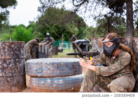 Team of friends paintball players playing together in battle 108389409