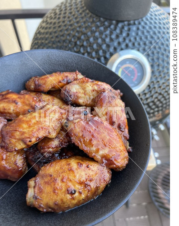 Chicken wings in kamado grill ready 108389474