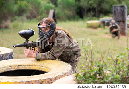 Portrait of team of adult people playing on paintball battlefield zone 108389489