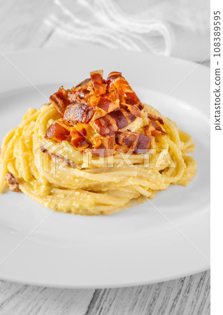Portion of carbonara pasta Portion of carbonara pasta 108389595
