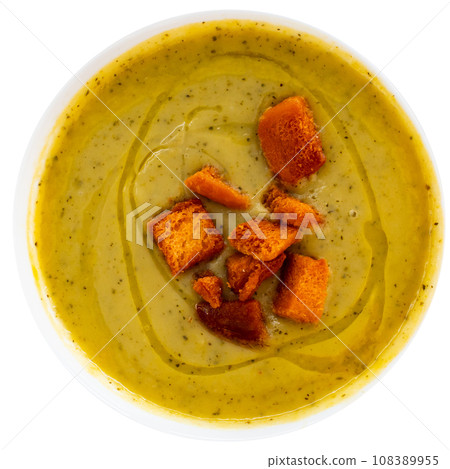 Vegetable puree soup garnished with crispy toasted bread 108389955