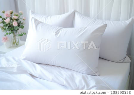 Comfortable soft pillows on the bed. Close-up white bedding sheets and pillow on light wall room background. Fresh bed concept Comfortable soft pillows on the bed. Close-up white bedding sheets and pillow on light wall room background. Fresh bed concept 108390538