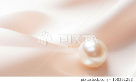 A single pearl resting on a white satin fabric. The pearl is round and has a high luster. The fabric is white and has a soft, flowing texture. The background is a gradient of light pink to white. A single pearl resting on a white satin fabric. The pearl is round and has a high luster. The fabric is white and has a soft, flowing texture. The background is a gradient of light pink to white. 108391298