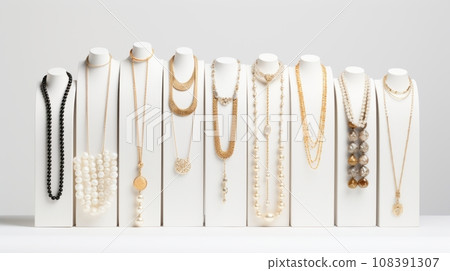 A row of mannequins with necklaces on them. The mannequins are all different shapes and sizes, and the necklaces are all different colors. The mannequins are standing in a straight line, facing the A row of mannequins with necklaces on them. The mannequins are all different shapes and sizes, and the necklaces are all different colors. The mannequins are standing in a straight line, facing the 108391307