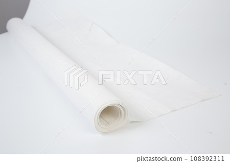 Roll of white Thick fabric on the white background Roll of white Thick fabric on the white background 108392311