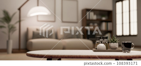 Copy space on a coffee table in a modern and cosy living room. blurry background. 108393171