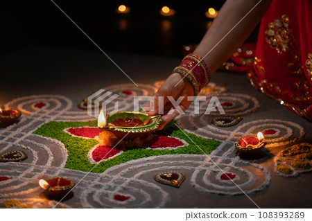 Clay diya lamps lit during diwali celebration, Diwali, or Deepavali, is India's biggest and most important holiday. 108393289