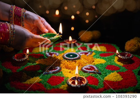Clay diya lamps lit during diwali celebration, Diwali, or Deepavali, is India's biggest and most important holiday. 108393290