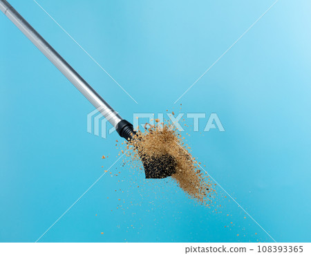 Trekking Poles put on sand soil ground. Telescopic trekking poles stick device for elderly people to walk with support protection hiking in woods mountain. Blue sky background isolated Trekking Poles put on sand soil ground. Telescopic trekking poles stick device for elderly people to walk with support protection hiking in woods mountain. Blue sky background isolated 108393365