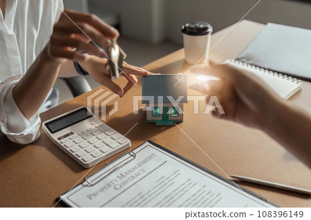 Client taking keys from real estate agent during meeting after signing rental lease contract or sale purchase agreement Client taking keys from real estate agent during meeting after signing rental lease contract or sale purchase agreement 108396149