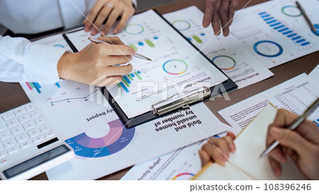 Business people teamwork with analysis cost graph on desk at meeting room 108396246