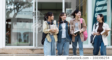 Group of Young Asian student walking and talking at university before class room. education, back to school concept 108396254