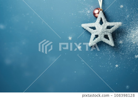 Blue Christmas decoration with ornaments in the shape of a star Blue Christmas decoration with ornaments in the shape of a star 108398128