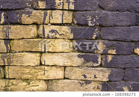 Texture of a brick wall with black paint totec elements. Texture of a brick wall with black paint totec elements. 108398273