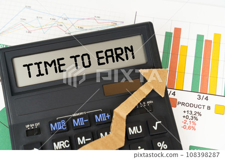 On the business charts there is a calculator on the screen with the inscription - Time to Earn On the business charts there is a calculator on the screen with the inscription - Time to Earn 108398287
