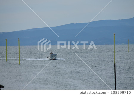 Omuta City Miike Port Fishing boat returning to the port, 108399710
