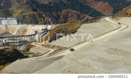 November 2023 Naruse Dam construction site - Heavy dump truck and Jimny in action - from Yumesennin Ohashi Bridge, Akita Prefecture 108400011