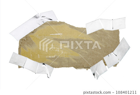 A sheet of corrugated paper is torn into pieces isolated on white background 108401211