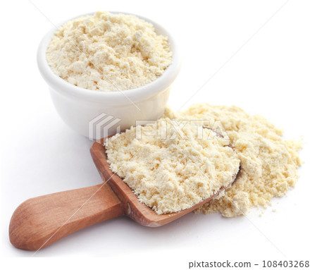 Gram flour in bowl and wooden scoop Gram flour in bowl and wooden scoop 108403268