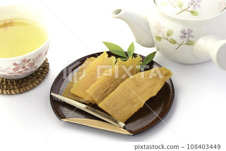 Taste of autumn and winter: handmade dried sweet potatoes and green tea Taste of autumn and winter: handmade dried sweet potatoes and green tea 108403449