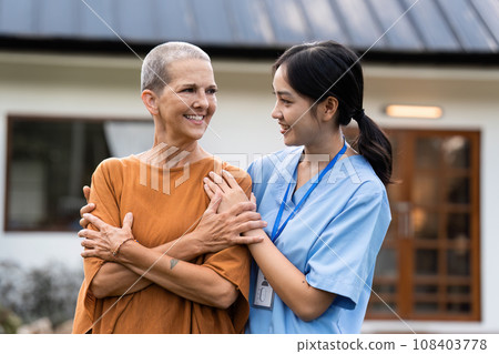elderly touch hand on back of hand caregiver or nurses to express thankful 108403778