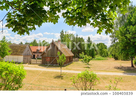 Small cozy houses. Wooden ancient buildings. Summer village and vacation. Farm bio products. Small cozy houses. Wooden ancient buildings. Summer village and vacation. Farm bio products. 108403839