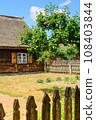 Small cozy houses. Wooden ancient buildings. Summer village and vacation. Farm bio products. 108403844
