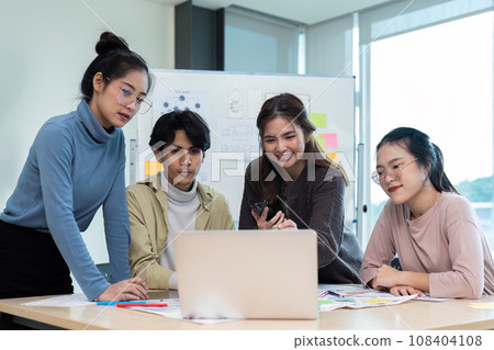 Team of ux developer and ui designer brainstorming interface wireframe design. Creative digital development agency Team of ux developer and ui designer brainstorming interface wireframe design. Creative digital development agency 108404108