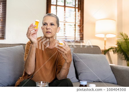 caucasian woman is sitting on prescription medication prescribed by doctor caucasian woman is sitting on prescription medication prescribed by doctor 108404308